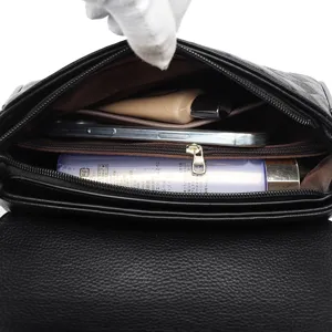 Black quilted leather crossbody bag with spacious interior compartment for daily commute