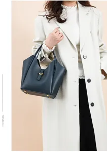 Genuine leather litchi pattern bucket bag, elegant shoulder crossbody bag detail for women.