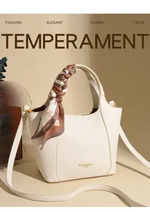 Detailed view of the women soft leather bucket bag handle scarf accessory elegant handbag.