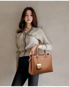 Elegant brown leather tote bag for women, large capacity shoulder bag with gold hardware.