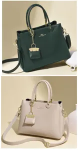 Elegant large capacity women leather handbag crossbody bag with chic hanging pouch charm.