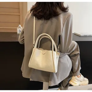 Detailed view of the soft PU leather shoulder bag in stylish beige color scene display.
