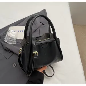 Stylish black PU leather shoulder bag for women, casual crossbody handbag with top handle.