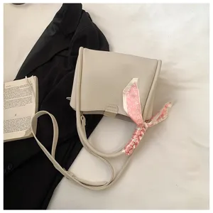 Korean style soft PU leather shoulder crossbody bag with elegant ribbon and large capacity.