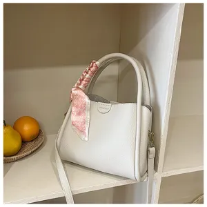 White PU leather tote shoulder bag featuring a pink heart print scarf accent on handle detail.