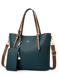 Large capacity dark green leather tote bag for women with brown handles and strap.