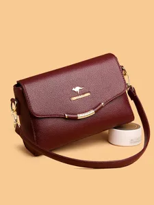 Classic burgundy leather crossbody bag with elegant flap design and gold hardware details.