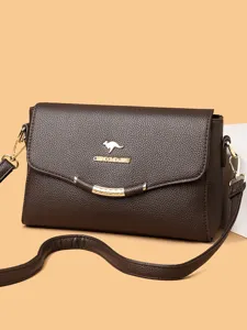 Casual women's brown leather crossbody shoulder bag with flap closure and elegant metallic accent.
