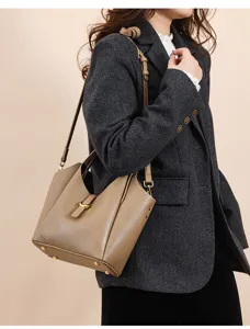 Genuine leather bucket bag featuring fine top grain texture and chic shoulder design.