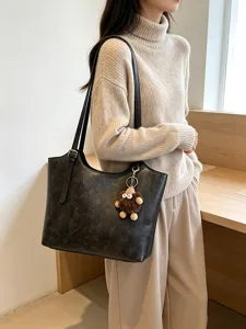 Vintage large capacity women tote bag with cute plush charm for daily commute and stylish office wear.