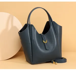 Stylish genuine leather bucket bag for women, litchi pattern tote with golden hardware.