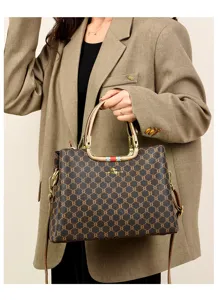 Elegant women retro monogram tote bag with top handle and crossbody strap for daily commute.