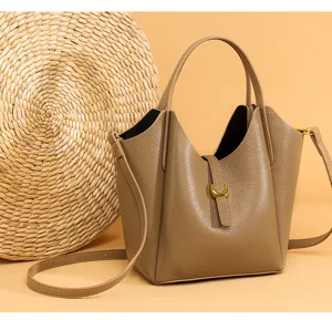 Detail view of the premium genuine leather bucket bag showing its exquisite texture and hardware.