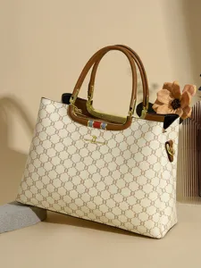 Elegant printed women's handbag with top handles, stylish commuting shoulder bag for daily use.