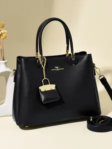 Classic black leather handbag for women, large capacity top handle shoulder bag with charm.