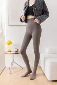 Close-up of ribbed fleece-lined thermal leggings in cozy brown, showing soft knit texture and snug fit.