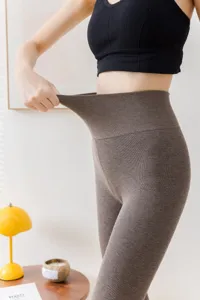 High waist ribbed thermal leggings detail showing stretchable fabric and cozy inner fleece lining.