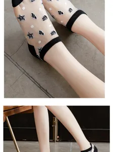 Sheer crystal silk socks with cute starfish patterns and black cuffs for summer wear.