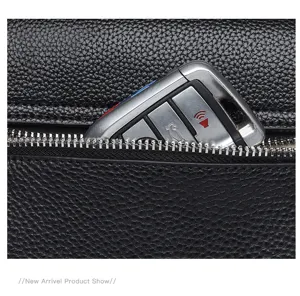 Detailed view of black genuine cowhide leather handbag zipper pocket with key storage showcase.