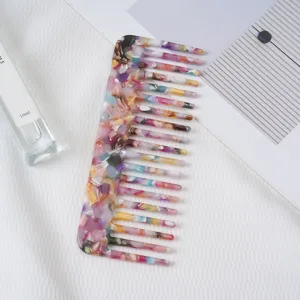 Detailed view of fashionable European acetate hair comb featuring colorful marble anti-static design.