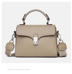 Women leather top handle crossbody bag stylish retro shoulder bag with metal lock closure.