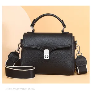Classic black leather top-handle crossbody bag for women, stylish daily shoulder purse with wide strap.