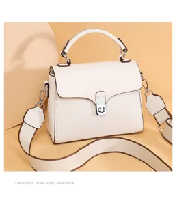 Stylish women genuine leather top handle crossbody bag with wide strap and metal lock closure.