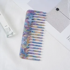 Acetate wide tooth hair comb with marble pattern, elegant purple and blue hair styling tool.