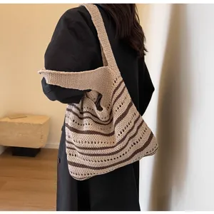 Detailed view of a chic striped knit shoulder bag with classic crochet design for everyday style.