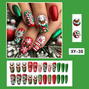 Christmas press-on nails detail, medium coffin fake nails featuring cute reindeer and snowflakes.
