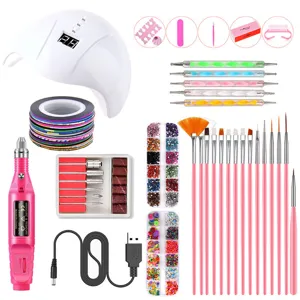 Ensemble complet d'outils de nail art avec lampe UV LED, perceuse électrique et strass.