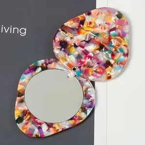 Portable cute colorful acetate makeup mirror detail view, compact rotating pocket mirror.