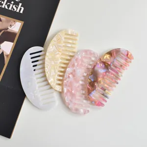 Detailed view of fashionable acetate hair combs with elegant marble patterns, anti-static design.