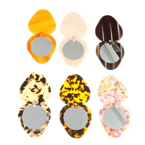 Portable swivel makeup mirror with cute strawberry acetate frame, compact pocket cosmetic tool.