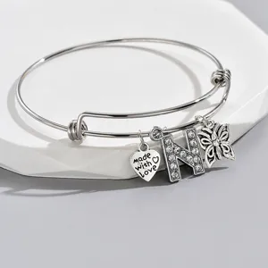 Adjustable silver tone letter N bracelet with rhinestone and heart charm details for women