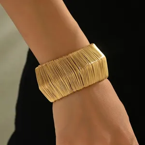 Wide gold multi-strand wire cuff bracelet for women, trendy statement metal open bangle.