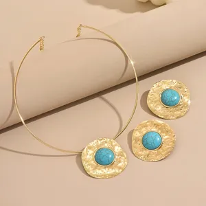 Exquisite vintage gold-tone torque choker necklace and matching turquoise earrings set for women.