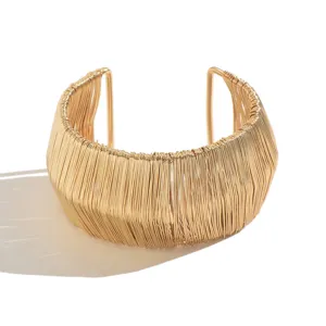 Gold wire wrapped open cuff bracelet for women, wide metallic statement bangle fashion jewelry.
