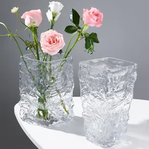 Transparent glass vase with glacier textured design, perfect for home decor and floral arrangements.