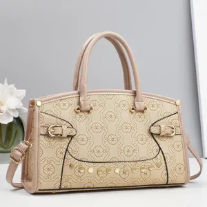 Fashion print patchwork handbag with monogram pattern, double top handles and chic shoulder strap.