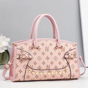 Chic pink monogram handbag with top handles and shoulder strap, stylish daily tote bag.