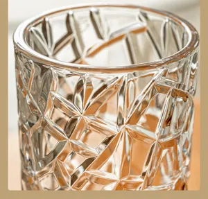 Clear faceted glass vase detail, transparent crystal texture close-up for home decor.