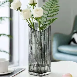 Nordic style transparent grey glass vase, modern ribbed flower arrangement container for home decor.