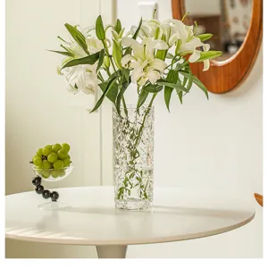 Transparent crystal glass flower vase for elegant home decor and fresh flower arrangement.