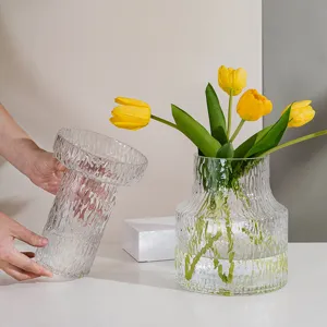Transparent glass vase with unique glacier texture for modern home decor and flower arrangement.