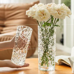 Clear glass flower vase with geometric diamond cut texture for modern home floral decor.
