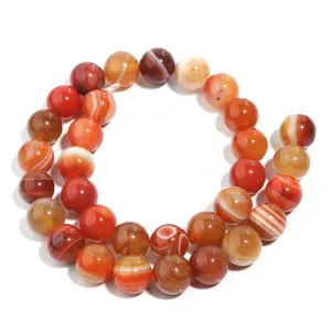 Detail van oranje gestreepte agaat kralen, gladde edelsteen ronde kraal voor DIY sieraden