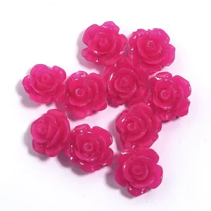 Close-up detail of hot pink 3D resin camellia flower charms, ideal for DIY jewelry and cases.