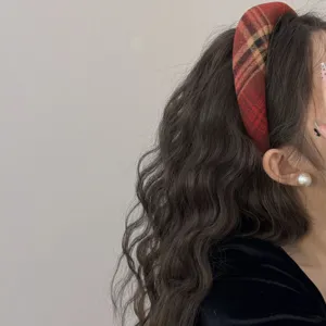 Detailed view of red plaid wide headband, preppy style fabric hair hoop for daily wear.