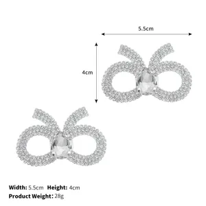 Sparkling rhinestone bow shoe clips, detachable metal crystal shoe buckles for footwear decor.